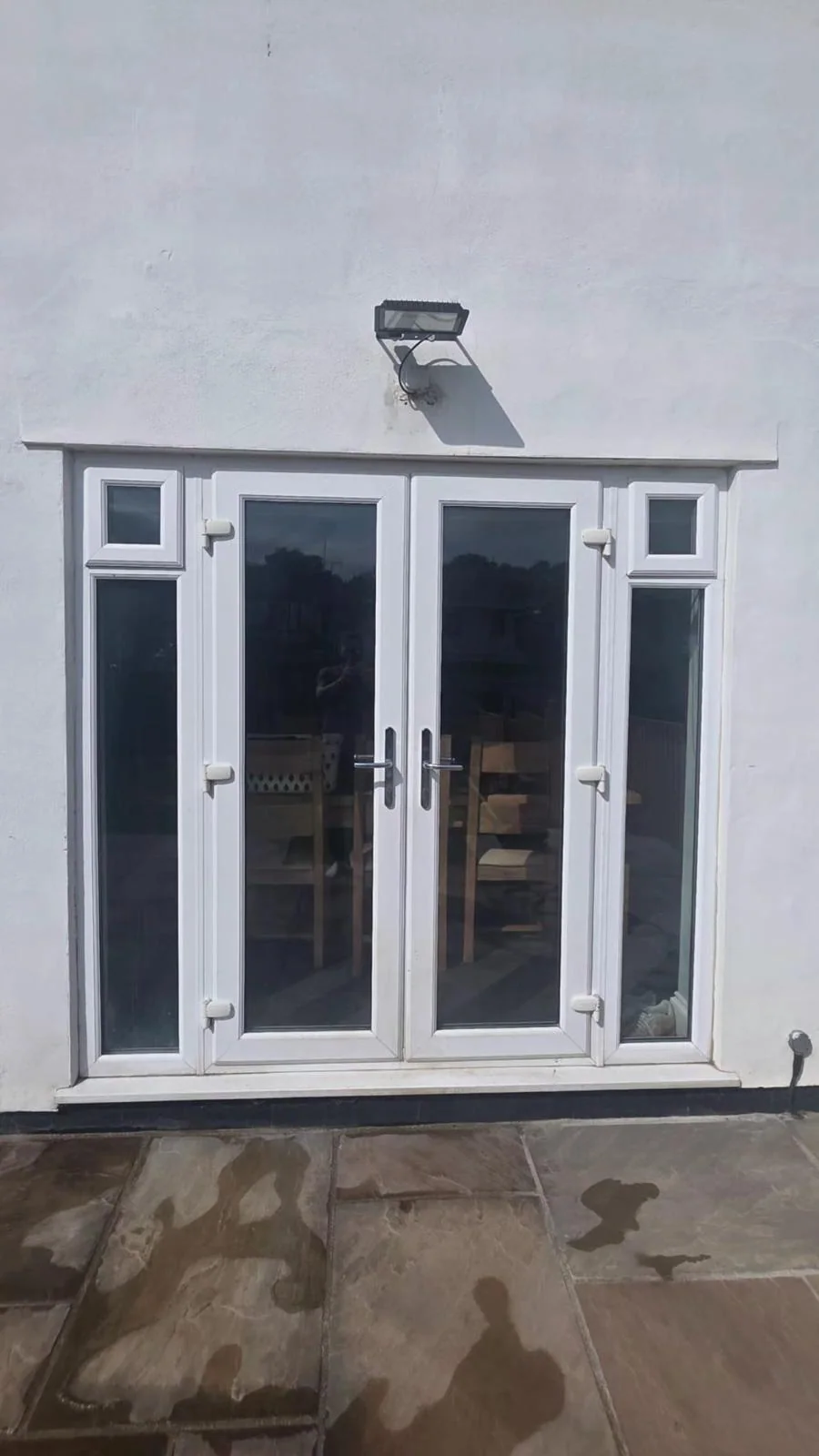 White French doors before replacement with aluminium bi-fold doors