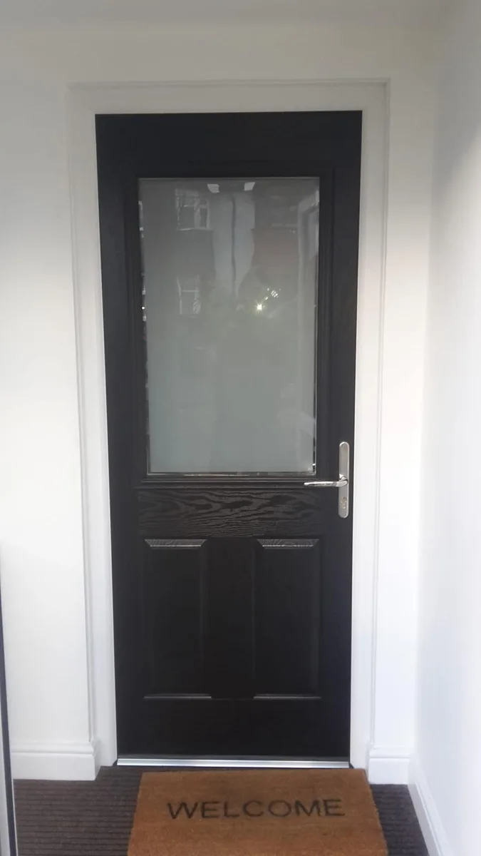 Inside view of a black composite door with a glazed top panel installed in Chigwell by Cii Double Glazing