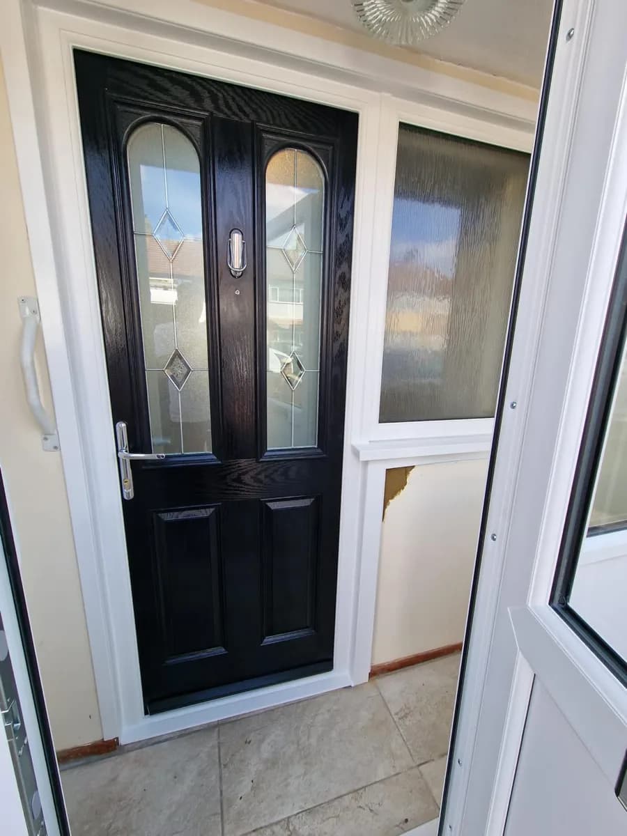 Black composite front door with lever handle installed in Chigwell by Cii Double Glazing