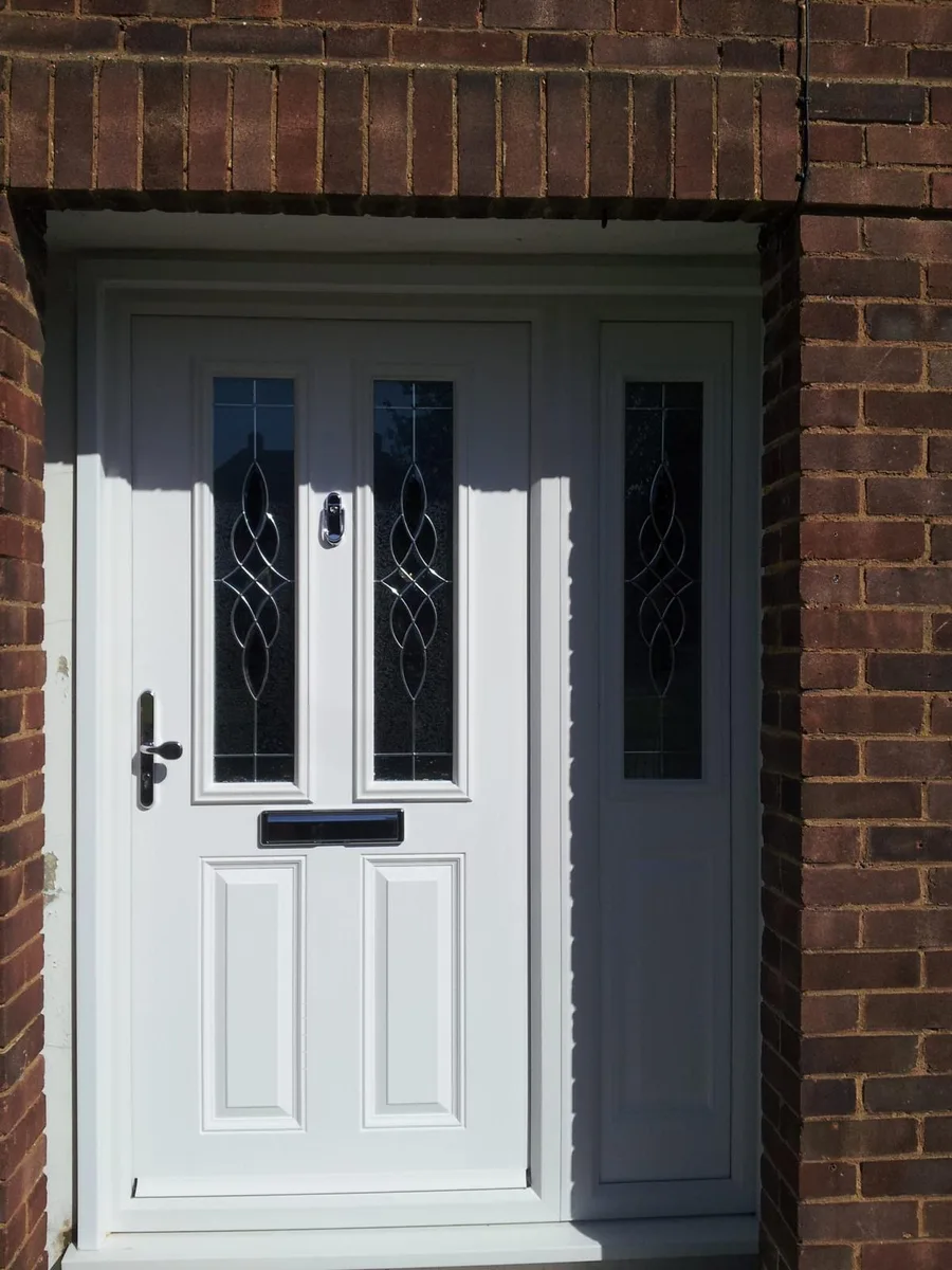 White composite front door with decorative glazing and a matching sidelight installed in Romford by Cii Double Glazing