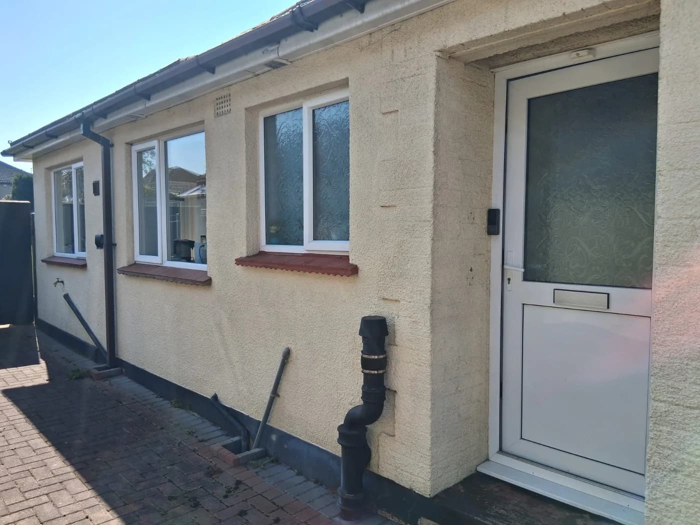 White uPVC side door and windows installed in Chelmsford by Cii Double Glazing