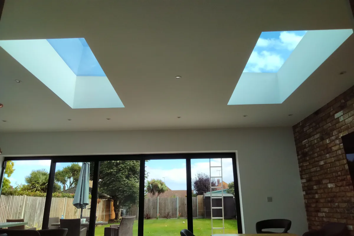 Bright extension interior showing high-level rooflight placement in Romford