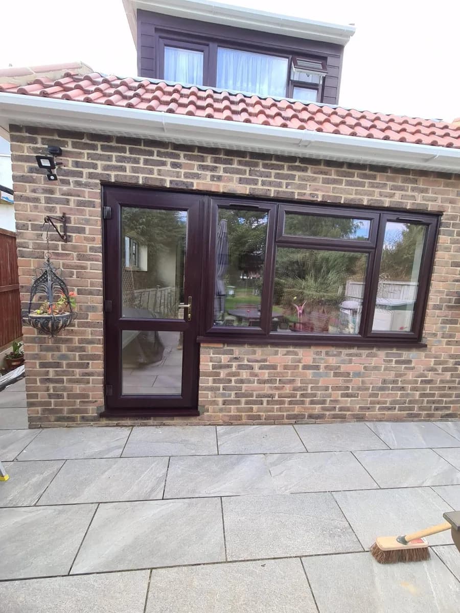 Rosewood uPVC glazed back door and casement windows installed on a single-storey extension in Chigwell by Cii Double Glazing