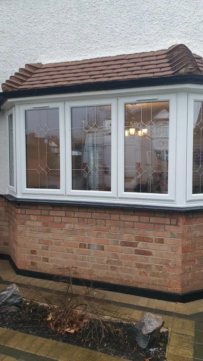 White uPVC bay window with decorative leaded glass installed in Romford by Cii Double Glazing