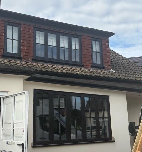 Dark flush sash windows with glazing bars installed in Woodford Green by Cii Double Glazing